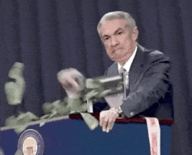 Jerome Powell enthusiastically printing money at a podium